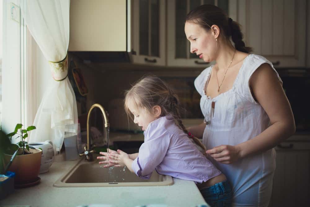 Mom and daughter enjoy cleaner water and cost savings from whole house water filters